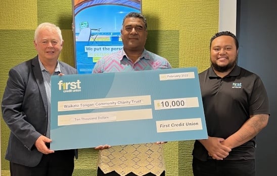 Mefi Naufahu, Chairperson for the Waikato Tongan Community Charity Trust, receives a $10,000 cheque towards providing assistance in Tonga from FCU Board Member and Hamilton City Councillor Rob Pascoe and FCU staff member Ben Tonga, who has family in Tonga.