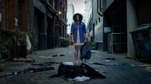 Millie looks down at empty suitcase, clothes strewn in alleyway. Photo: Provided