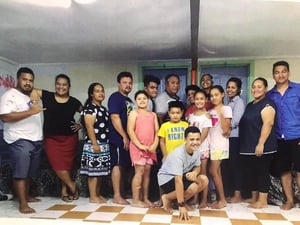 Ally (third from right) with her family in Samoa