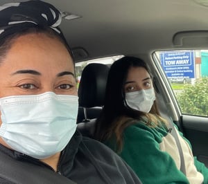 Reporter Soana Aholelei and her daughter waiting for a Covid test. Photo: Supplied