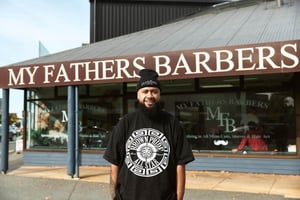 Owner Mataio Taimalelagi (Matt Brown) in front of his barber shop, My Fathers Barber. Photo: Provided