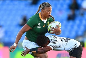 Aseza Hele of South Africa runs the ball during the Pool C Rugby World Cup 2021 match between Fiji and South Africa