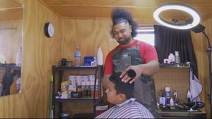 Barber operates tiny shop outside his home to be closer to his children
