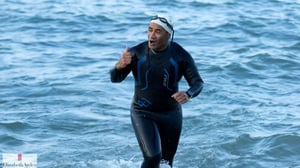 56-year-old athlete on track to complete 18th Ironman competition