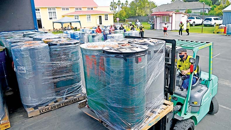 The drums are loaded on to a truck in Gisborne prior to being transported to Auckland for shipment. Photo: Paul Rickard/Gisborne Herald