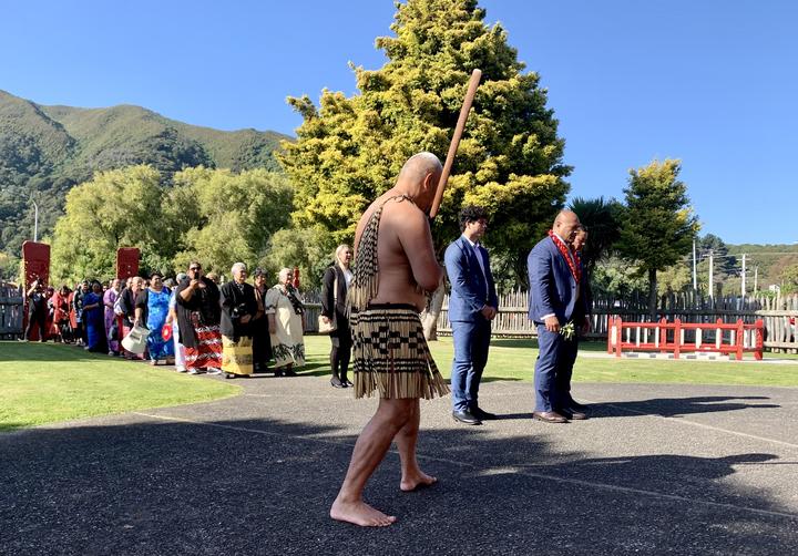 Judge Michael Mika leading the manuhiri on to Waiwhetū Marae. Photo: Dominic Godfrey / RNZ Pacific