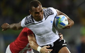 Fiji's Osea Kolinisau scores a try in the men’s rugby sevens gold medal match. Photo: AFP