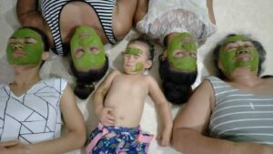Baby Lupe and family applying their traditional healthy face masks. Photo: Provided